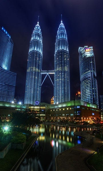 The Petronas Twin Towers & KLCC Park as night (2011) Ahmad Rithauddin | Wikimedia