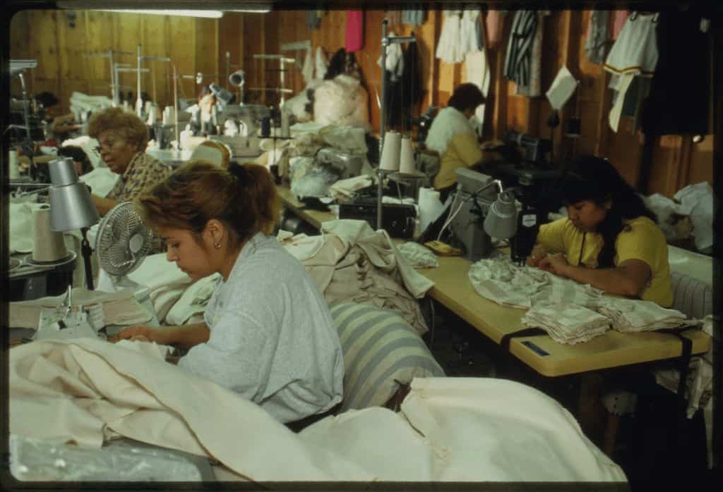 Sewing machine operators making garments (1994) M. Cooper & Thomas D. Carroll | Library of Congress
