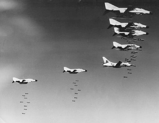In this handout from the U.S. Air Force, F4 Phantom jets rain bombs on unspecified targets over North Vietnam, Dec. 1965. The photo was made prior to the halt of air strikes on Dec. 24, 1965. (December 1965) | AP Photo/USAF