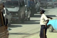 A member of the Haitian National Police (HNP) keeps traffic moving on the busy streets in downtown Port-au-Prince, Haiti (1996) PFC T. Hall-Leahy | National Archives Catalog