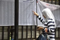 A young woman checking her name in the elections list at one of the voting stations in Cairo, Egypt (23 May 2012) UN Women/Fatma El Zahraa Yassin | Flickr