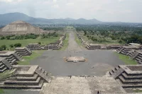 The view looking down the Avenue of the Dead from the vantage point of the Pyramid of the Moon, with the Pyramid of the Sun appearing on the left side of the photo, showcasing the archaeological site of Teotihuacan, one of the sites Mark Feldman visited while he was in Mexico to negotiate the 1970 bilateral treaty concerning cultural property