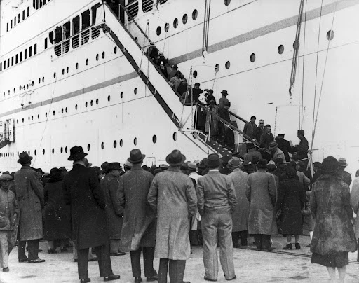 Jewish Refugees disembarking from a ship in Shanghai, 1940. Wikimedia commons, from U.S. Holocaust Museum