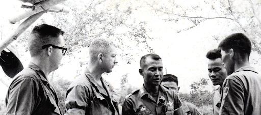 Second Lieutenant Donald Bishop (Second to Left) and ROK Infantry Commander and Interpreter with Vietnamese Village Leader (right) (September 30, 2022) Donald Bishop