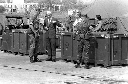 U.S. Ambassador to Lebanon, Robert Dillon, talks to COL James M. Meade, commander, 32nd Marine Amphibious Unit, left, upon his arrival at Beirut International Airport. U.S. Marines had been assigned to Lebanon as part of a multinational peacekeeping force following a confrontation between Israeli forces and the Palestine Liberation Organization (01 September 1982) Robert Feary | The U.S. National Archives | Picryl