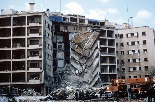 A view of damages to the U.S. Embassy caused by a terrorist bomb attack. Marines were there participating as members of a multinational peacekeeping force (29 April 1983) The U.S. National Archives | NARA & DVIDS Public Domain Archive