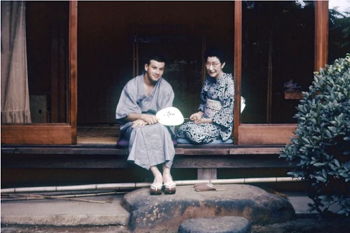 (From left) John Ratliff III wearing a yukata, Mrs. Yoshikawa, at the Yoshikawa house (1957). John Ratliff III.