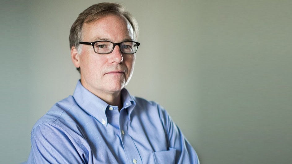 Image of Steve Coll in a blue button-down, long sleeve shirt.