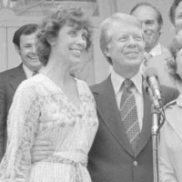 Jimmy Carter participates in the swearing-in ceremony for Patricia Derian. NARA