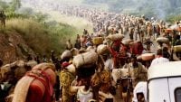 Rwandese refugees cross the border to Tanzania from Rwanda on May 30th 1994. Jeremiah Kamau/Reuters