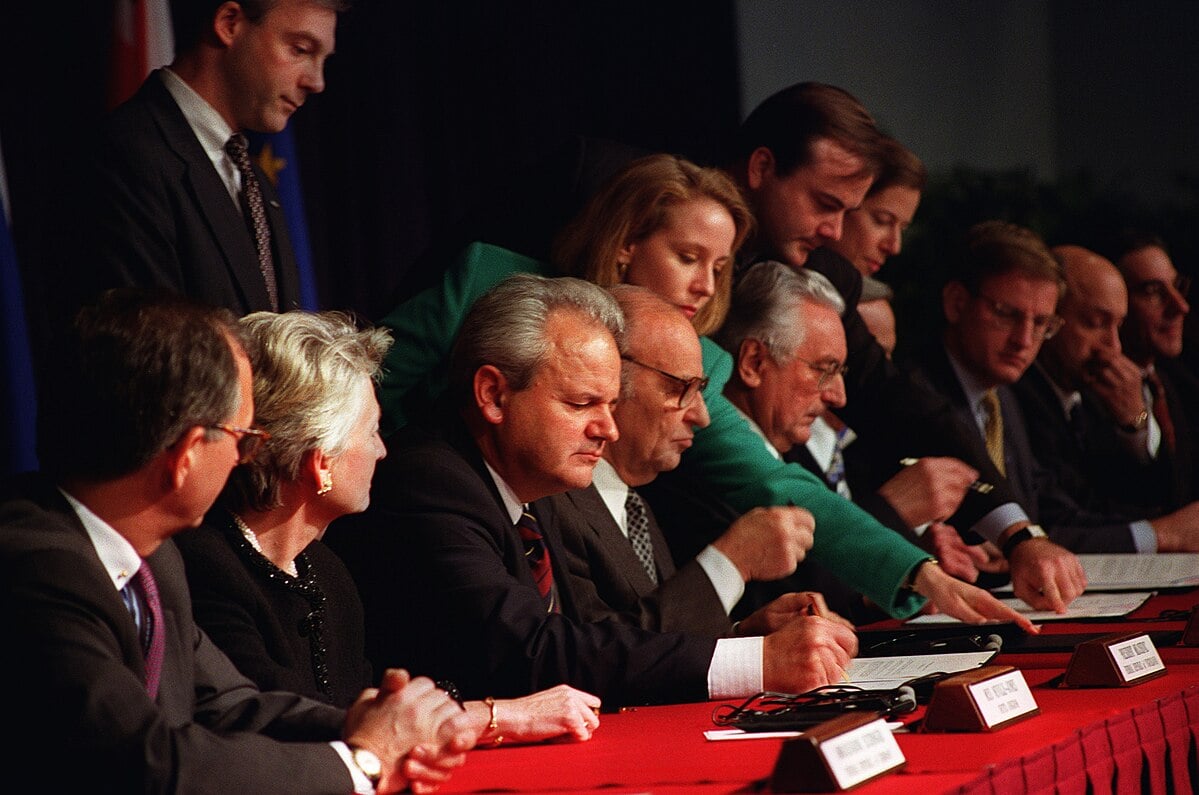 The three Balkans presidents initial the draft of the Dayton Peace Agreement on November 21, 1995, in Dayton, Ohio | Wikimedia Commons/U.S. Air Force