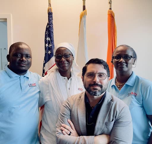 Guy Martorana, center right, with the Democracy, Rights and Governance Team in Côte d’Ivoire in 2025.        
Photo courtesy of Guy Martorana.